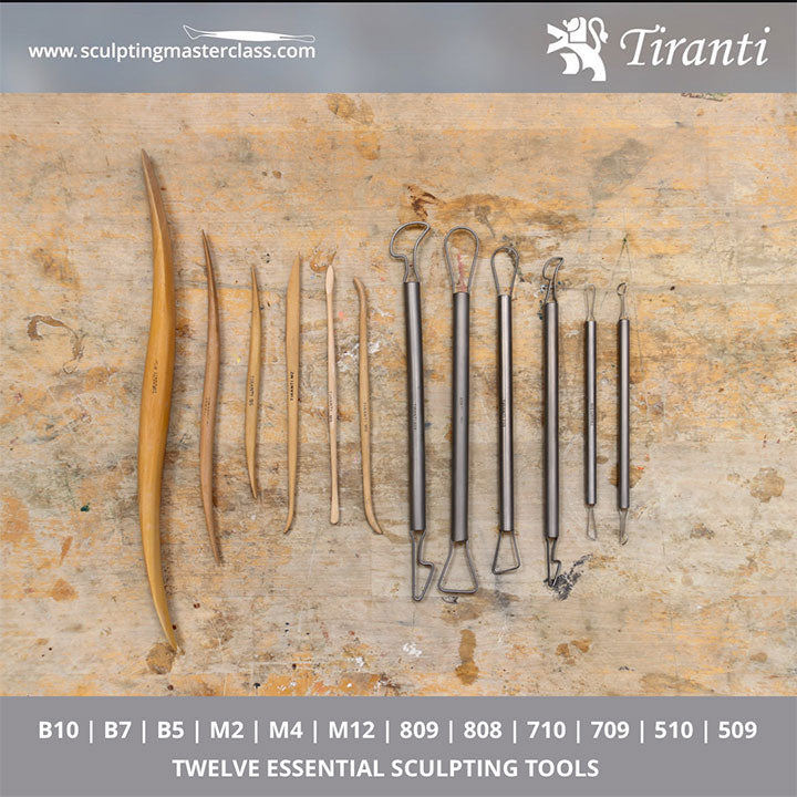 Set of twelve essential sculpting tools on a textured surface with Tiranti branding.